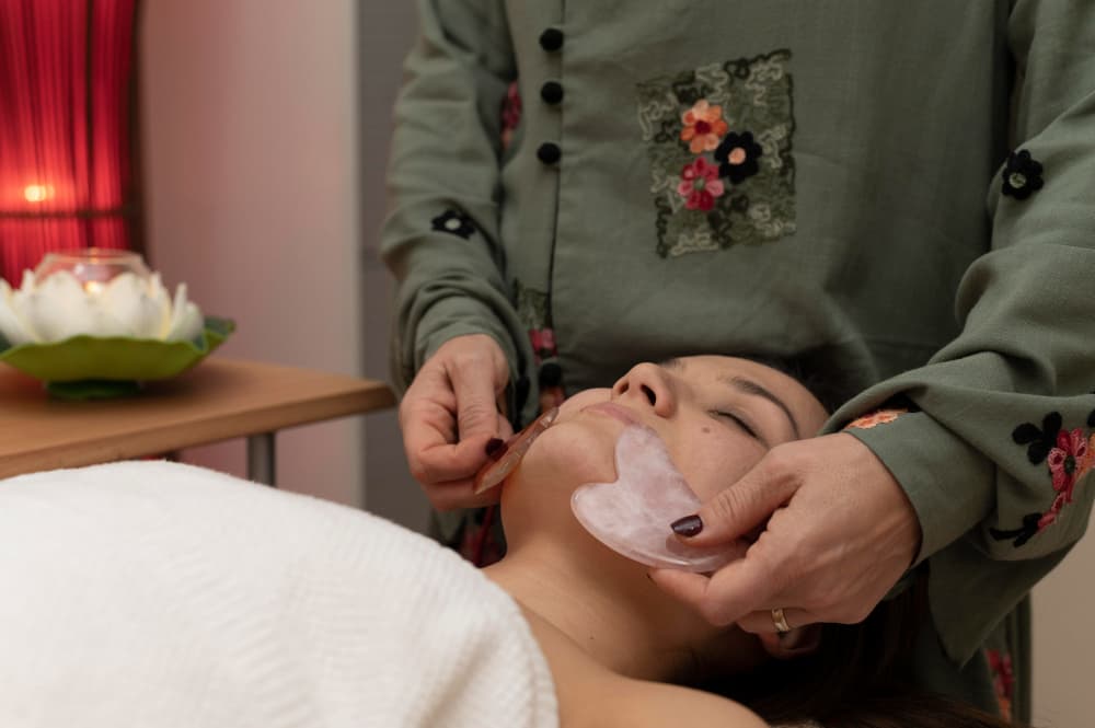 Dr. Anjali Dabas performing an ENT assessment in the Shalakya Tantra clinic.