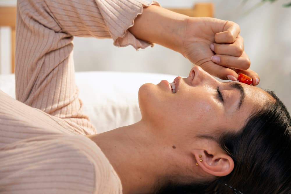 Practitioner performing Netra Tarpana with medicated ghee over the eye.