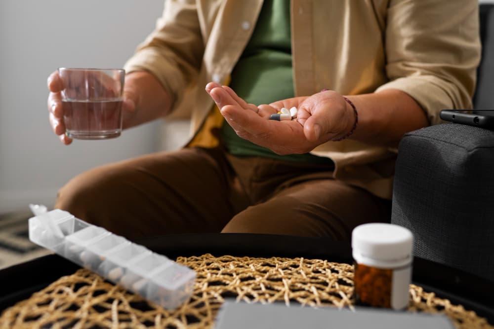 Agad Tantra physician reviewing liver function tests and toxin exposure history during a de-addiction consultation.