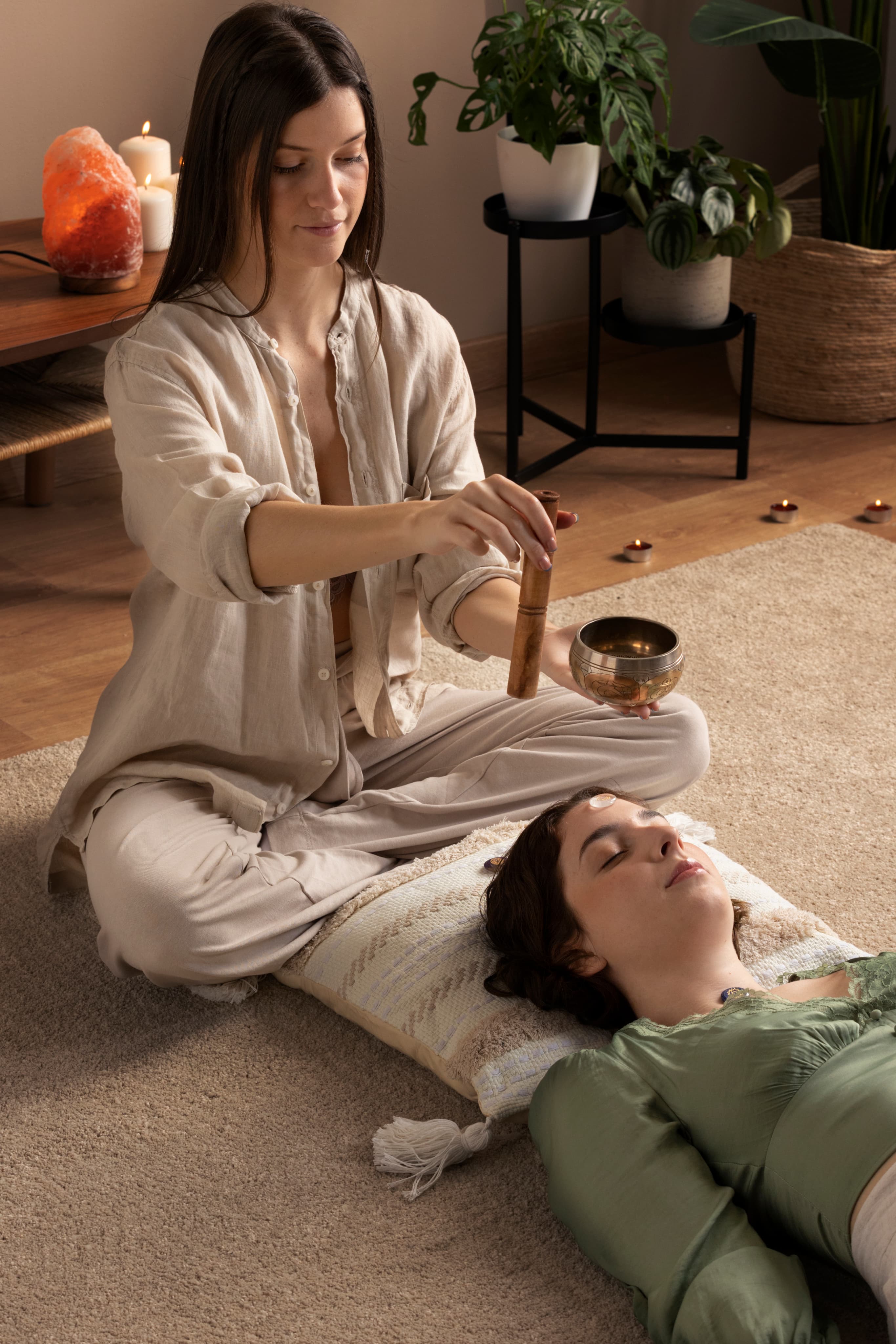 Practitioner performing a guided Ayurvedic therapy in a calming room.